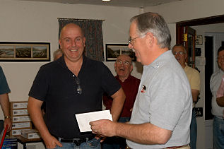 Gary presents a cheque for GBP40.00 in the name of IPMS Ottawa to support the Phyllis Tuckwell Hospice